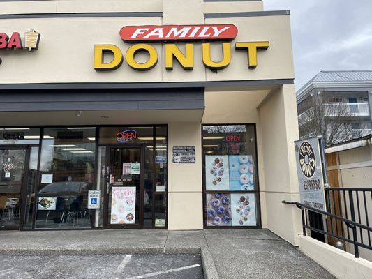 The Family Donut storefront in the Northgate strip plaza, red and yellow sign above the door